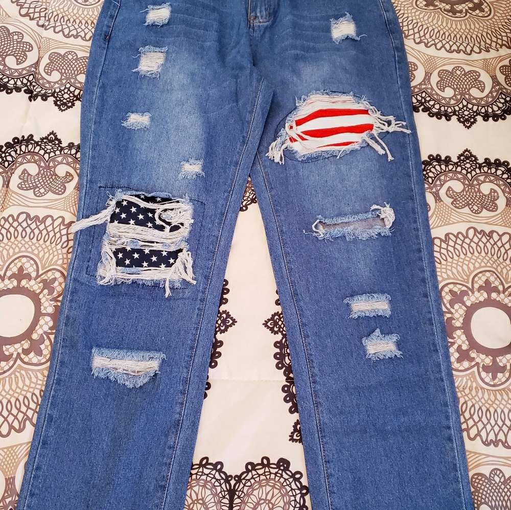 Distressed jeans with patriotic patches